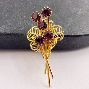 VINTAGE Purple rhinestone and gold tone metal filigree flower bouquet brooch pin